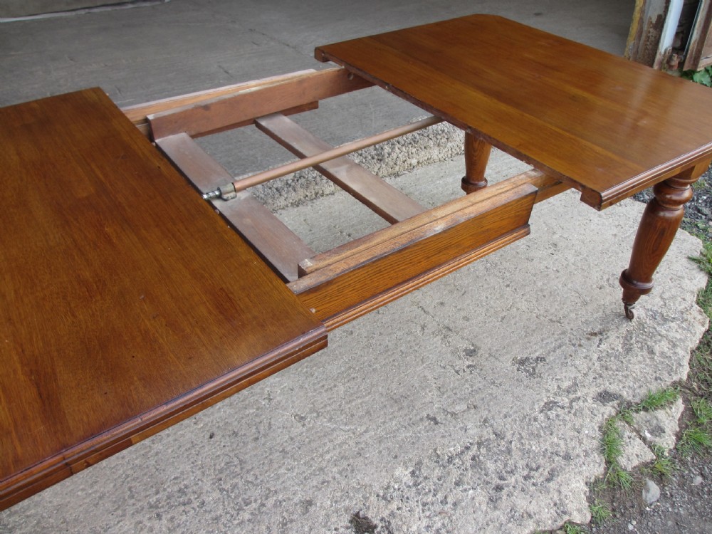 Victorian golden oak wind out extending dining table View VI