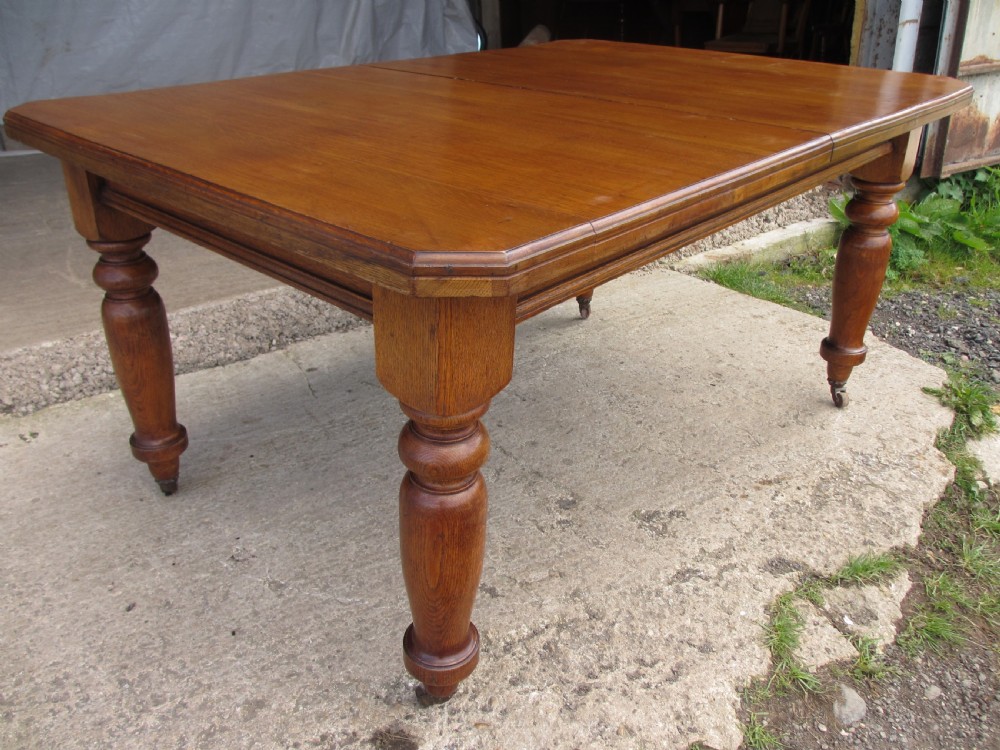 Victorian golden oak wind out extending dining table View IX