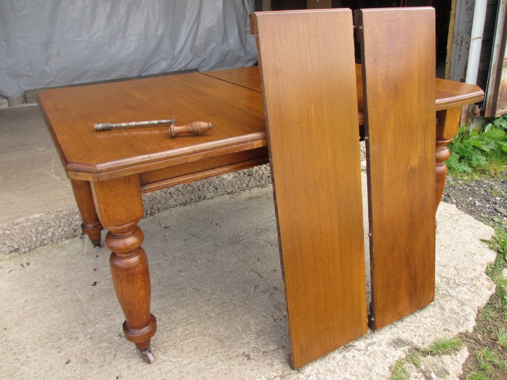 Victorian golden oak wind out extending dining table View X