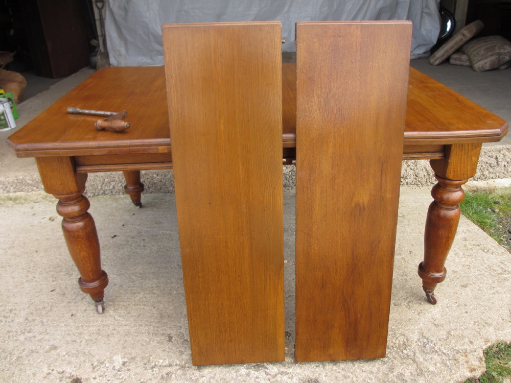 Victorian golden oak wind out extending dining table View XI