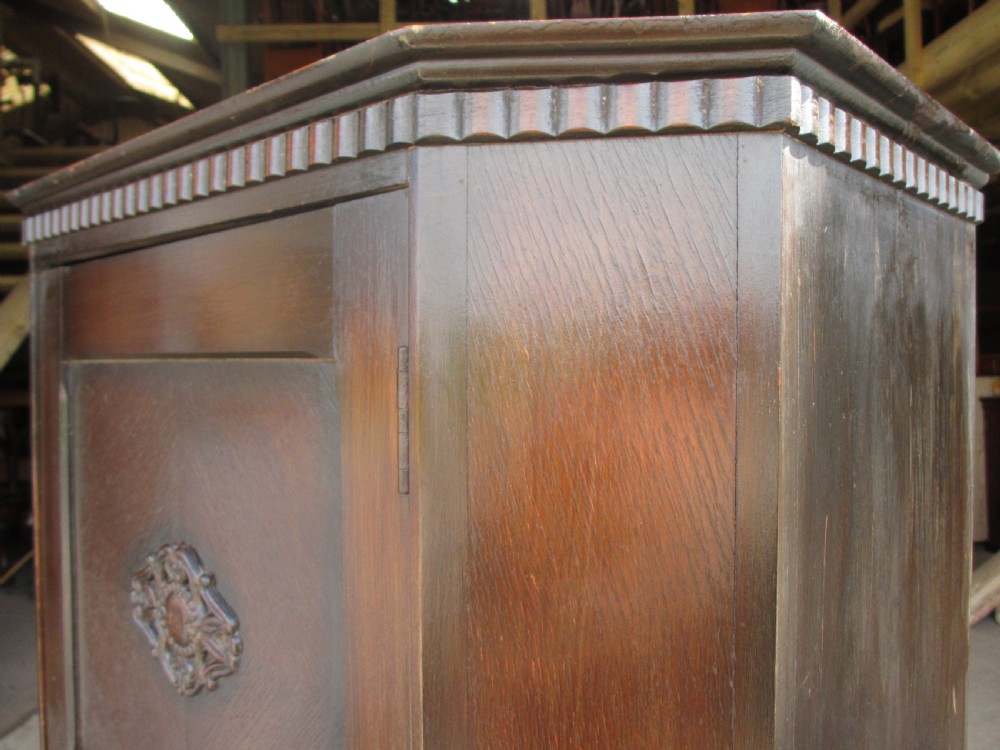 Early 20th century oak canted cornered hall cupboard View II