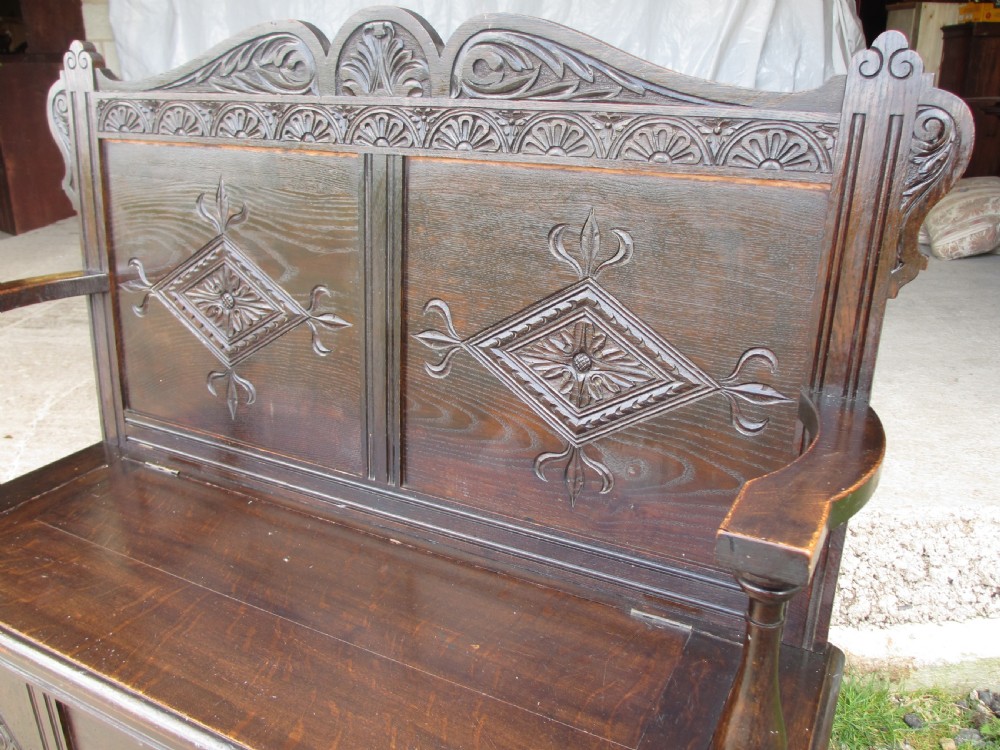 Victorian carved oak storage settle View III