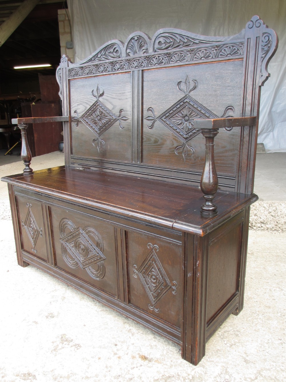 Victorian carved oak storage settle View XII