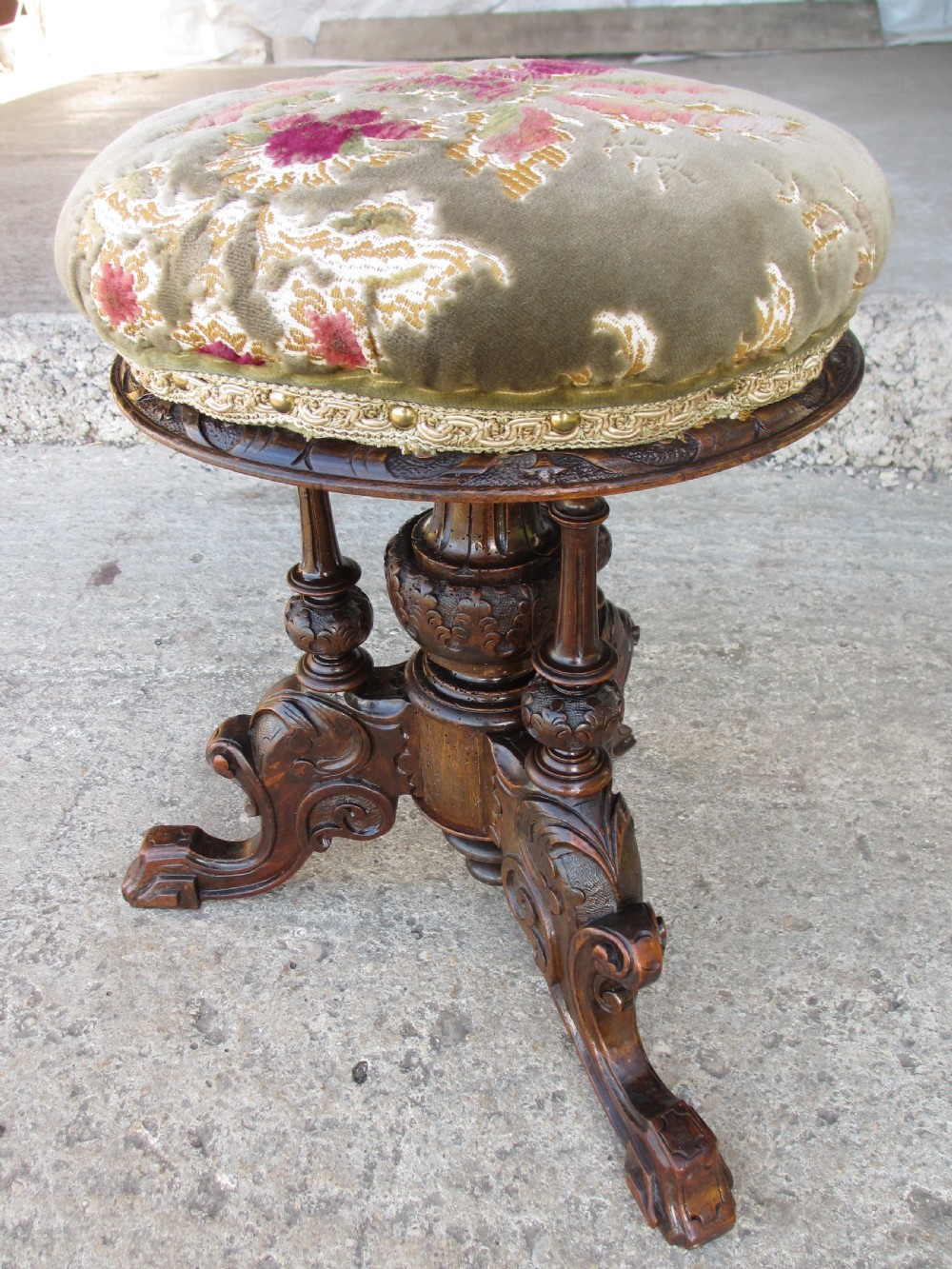Victorian mahogany upholstered adjustable carved piano stool