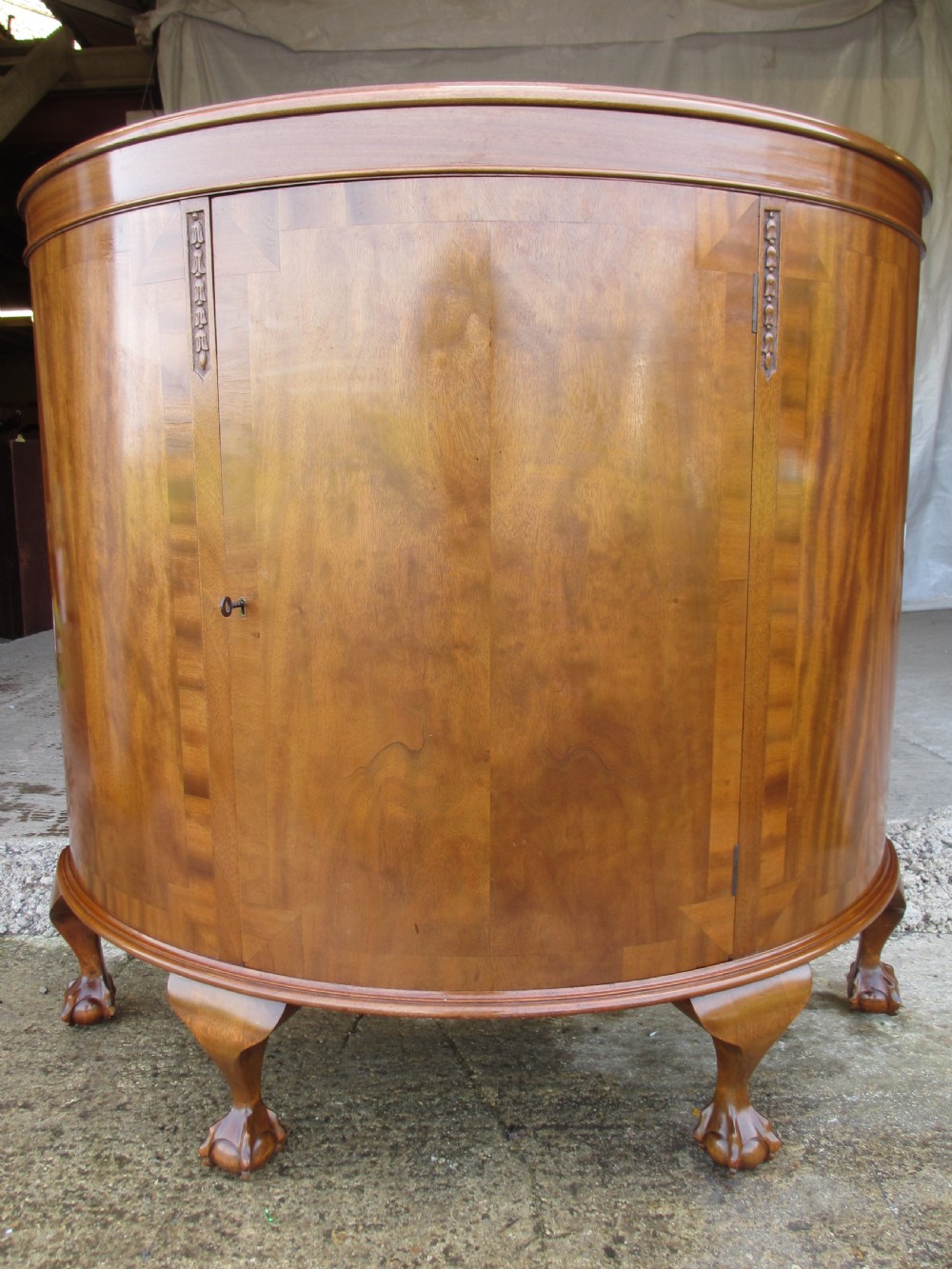 Early 20th century cross banded mahogany demi-lune style side door cabinet