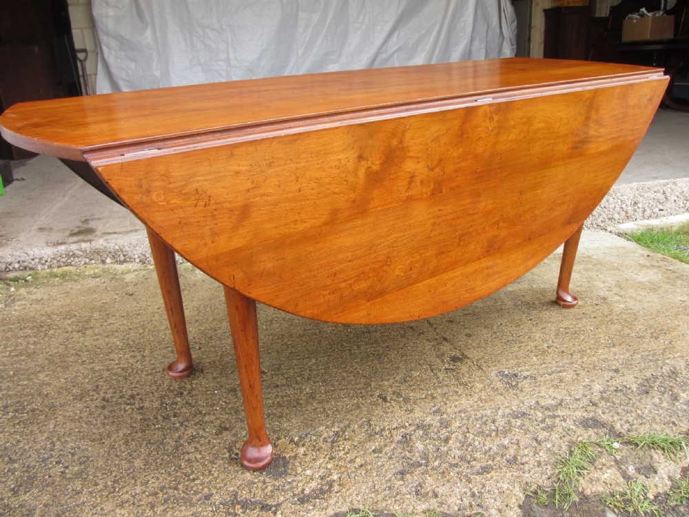 19th century mahogany drop leaf oval wake table  View IX