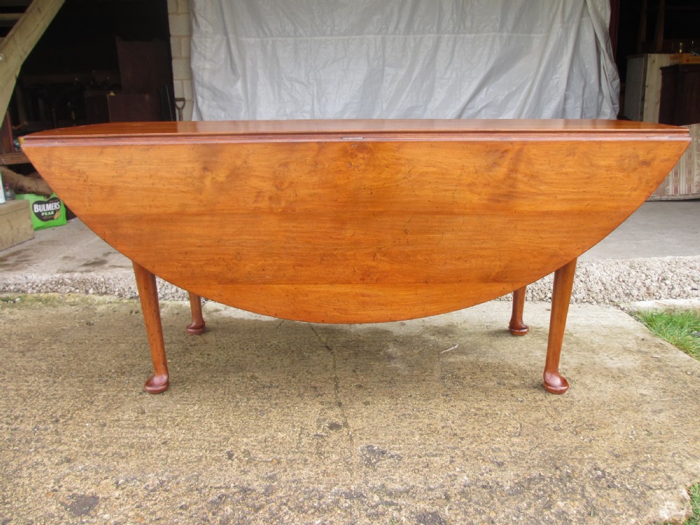 19th century mahogany drop leaf oval wake table  View XI