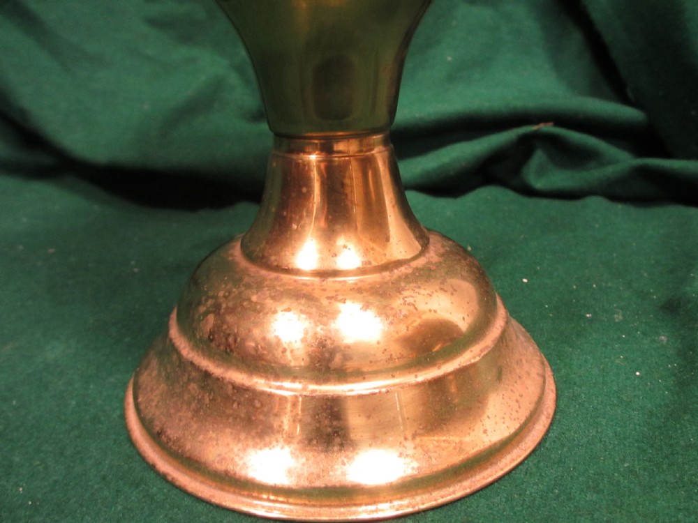 A Victorian oil lamp featuring a brass pedestal base and reservoir, a frosted glass shade with a frilled rim and floral relief patterns, and a clear glass chimney. View IV