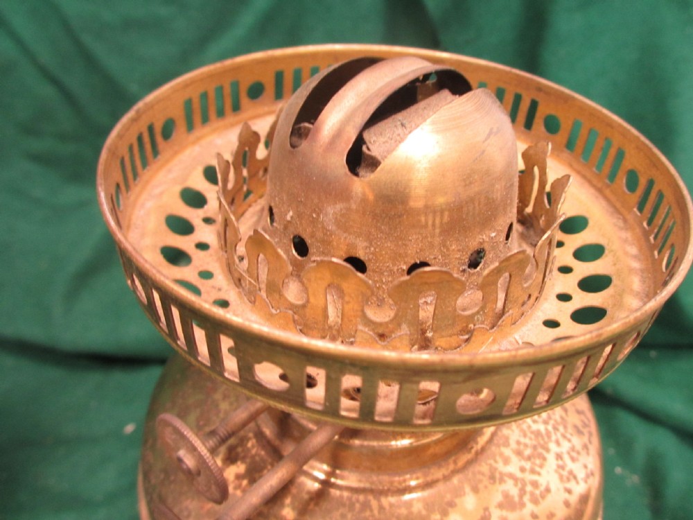 A Victorian oil lamp featuring a brass pedestal base and reservoir, a frosted glass shade with a frilled rim and floral relief patterns, and a clear glass chimney. View VIII