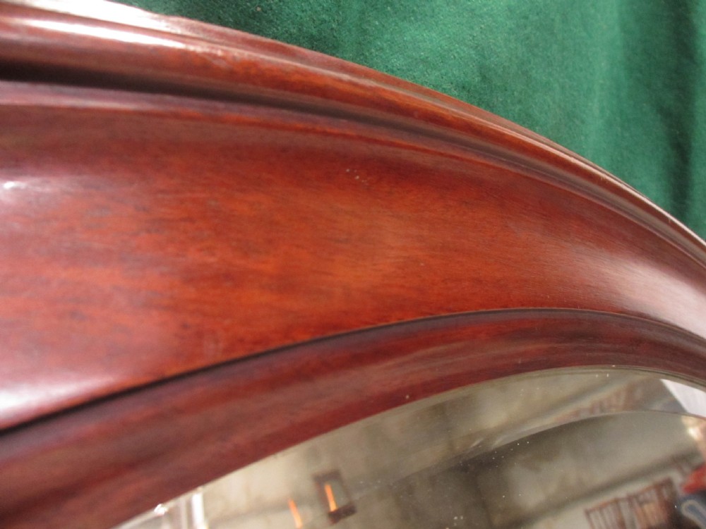 Late 19th century mahogany oval bevel glass mirror View VI