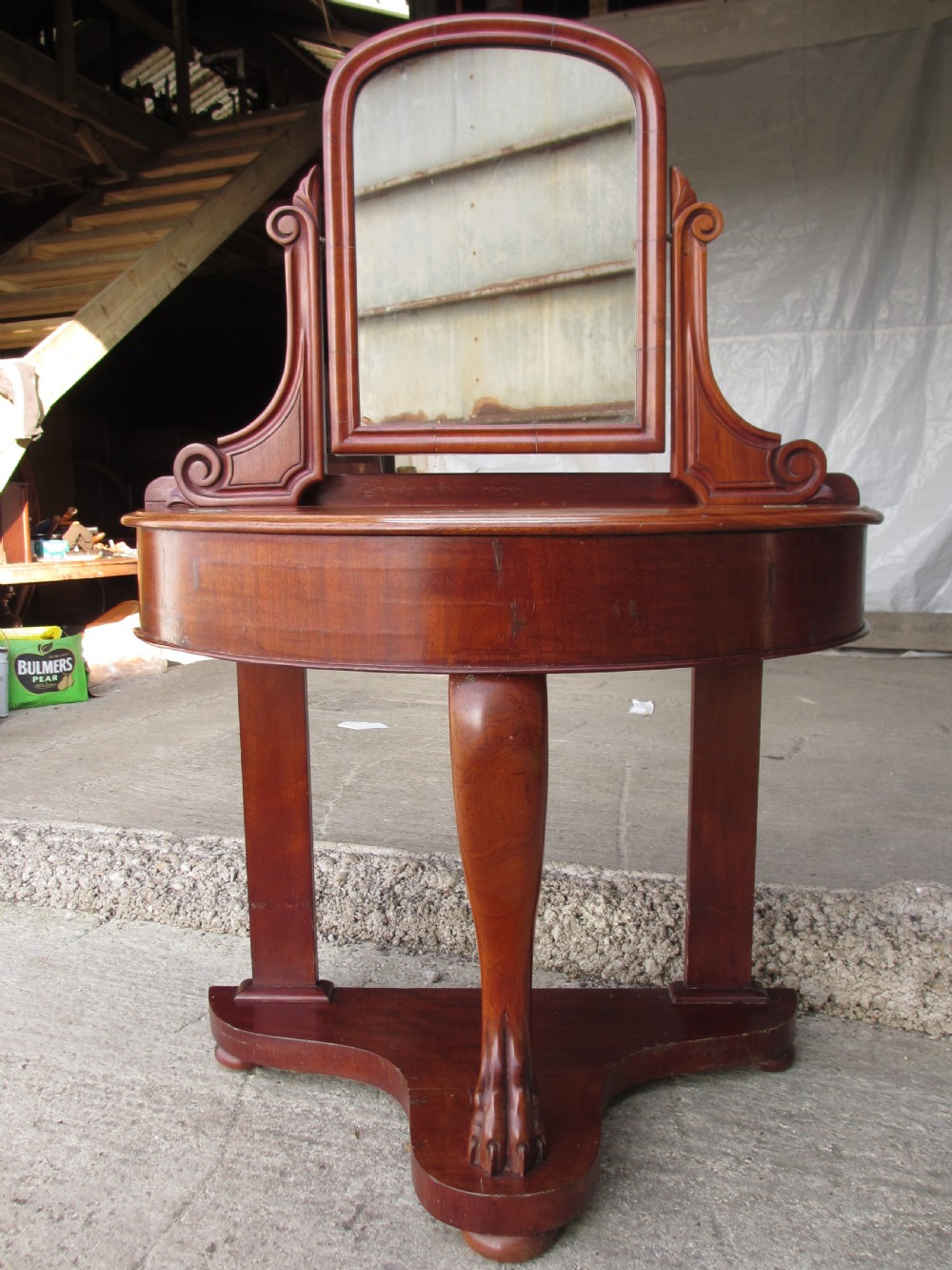Victorian mahogany demi-lune dressing table featuring an arched swing mirror flanked by scrolled supports and a central carved cabriole front leg. View II