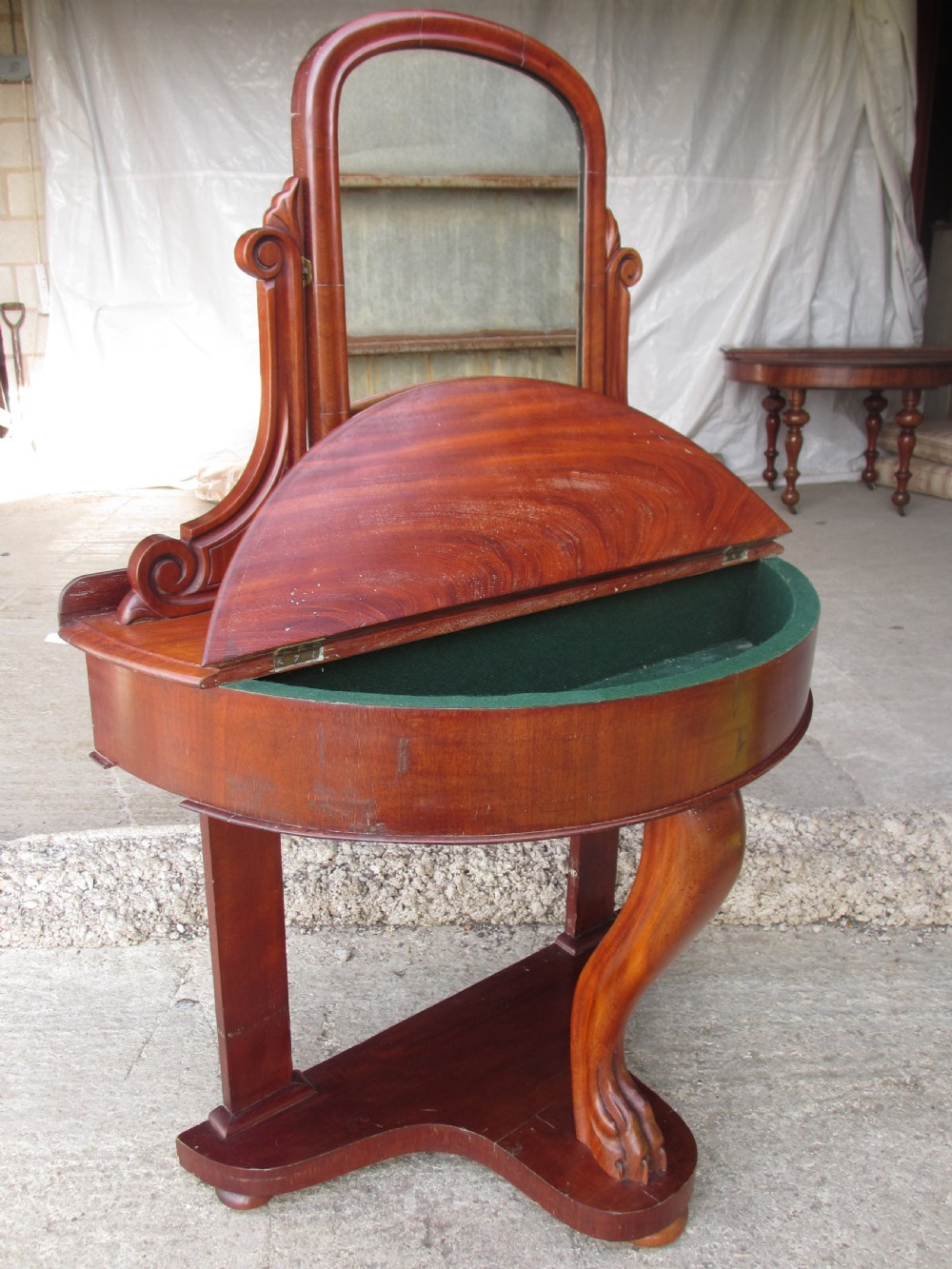 Victorian mahogany demi-lune dressing table featuring an arched swing mirror flanked by scrolled supports and a central carved cabriole front leg. View IX