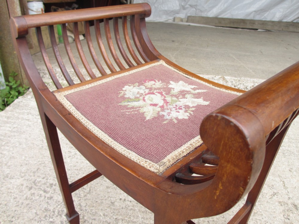 Edwardian mahogany cradle shaped piano stool with tapering legs View III