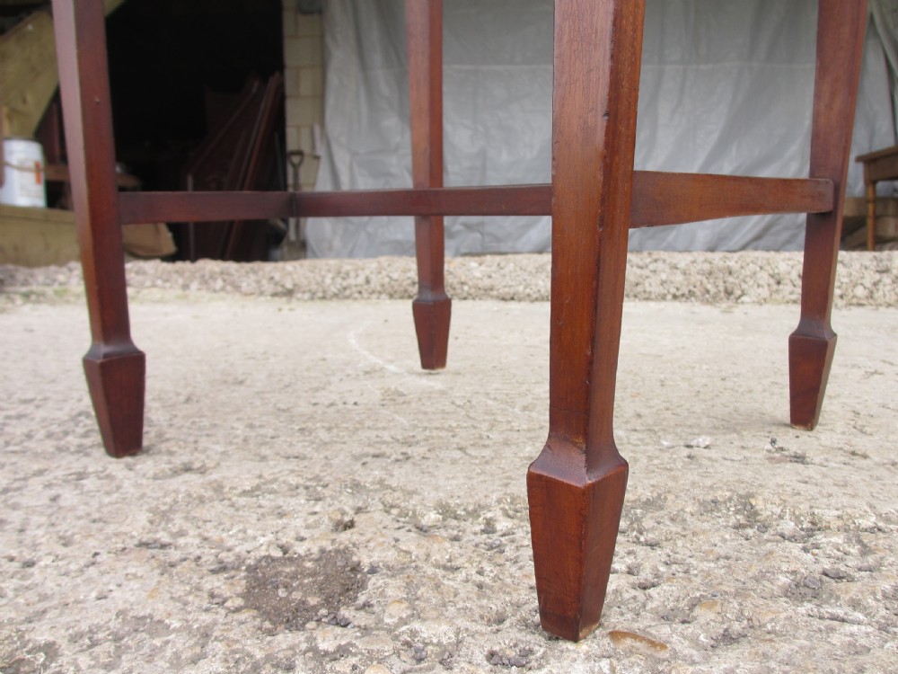 Edwardian mahogany cradle shaped piano stool with tapering legs View IV
