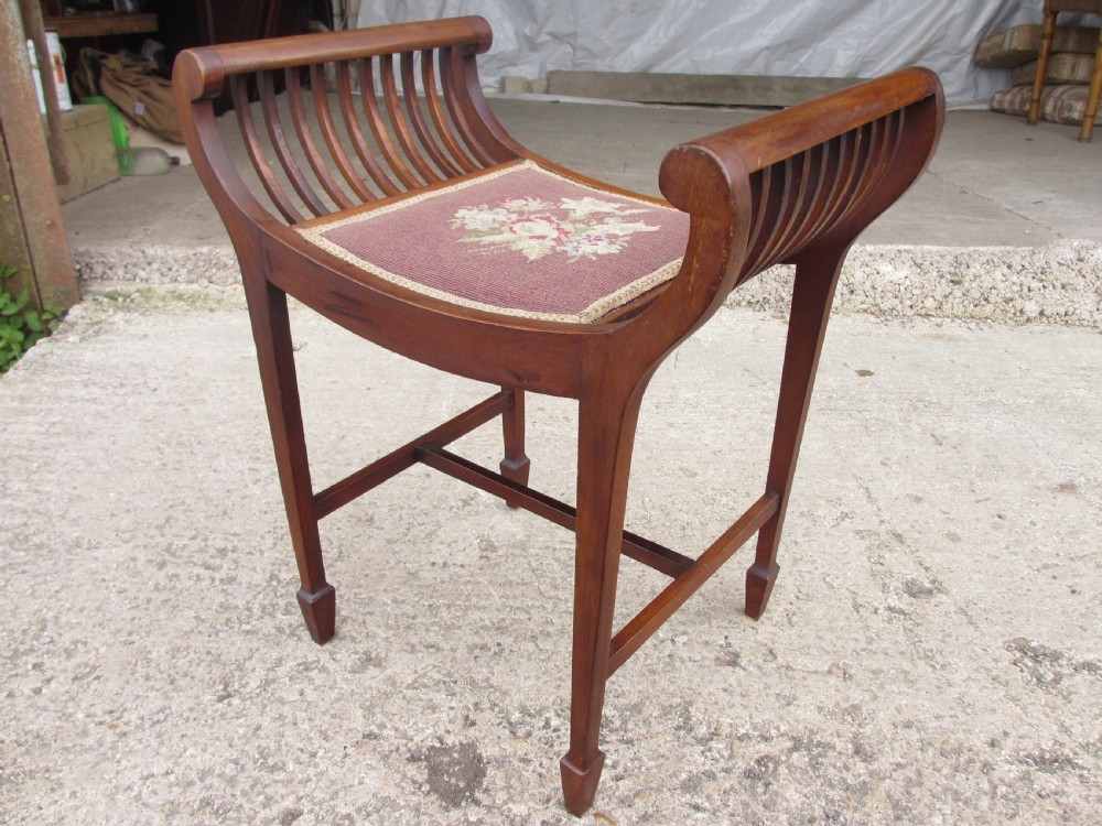 Edwardian mahogany cradle shaped piano stool with tapering legs View VII