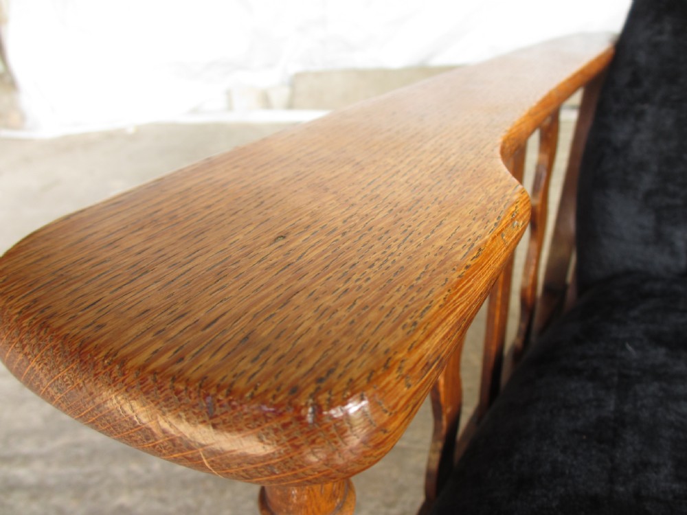 A pair of Edwardian oak plantation style Art Deco adjustable lean back armchairs View V