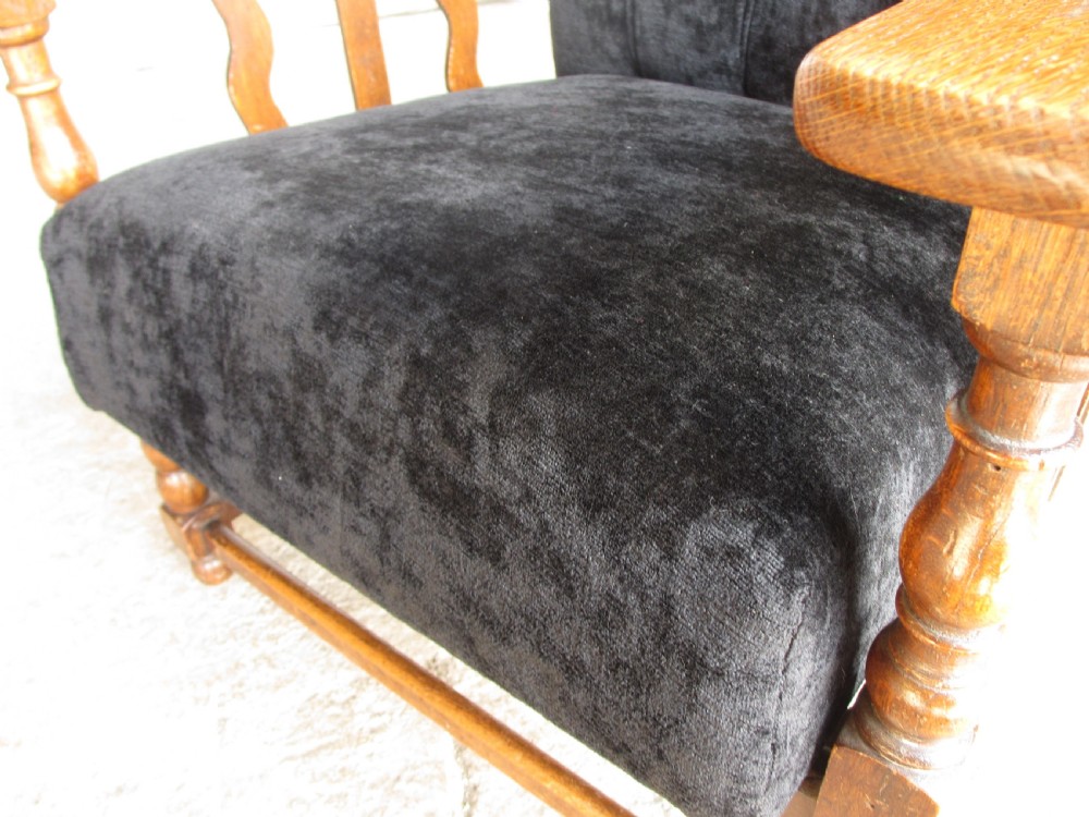 A pair of Edwardian oak plantation style Art Deco adjustable lean back armchairs View VII