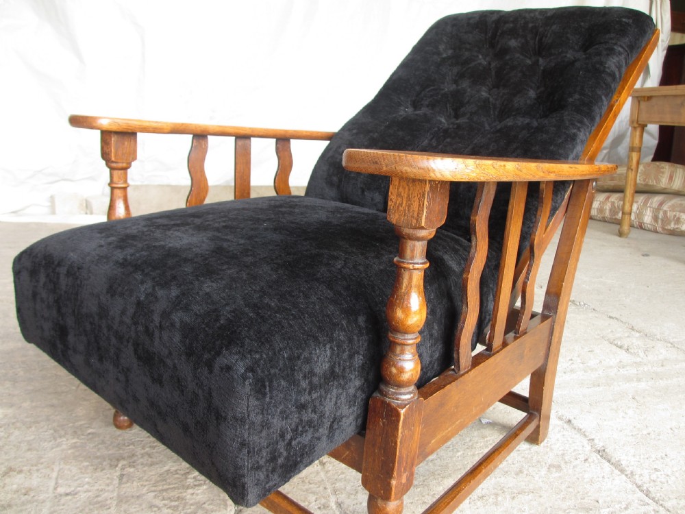 A pair of Edwardian oak plantation style Art Deco adjustable lean back armchairs View VIII