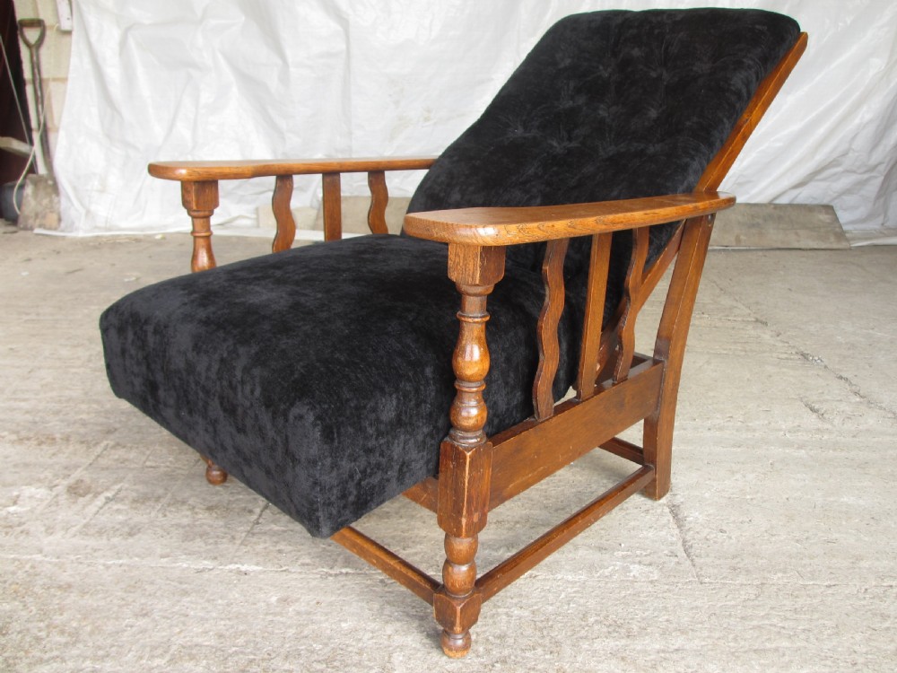 A pair of Edwardian oak plantation style Art Deco adjustable lean back armchairs View XI