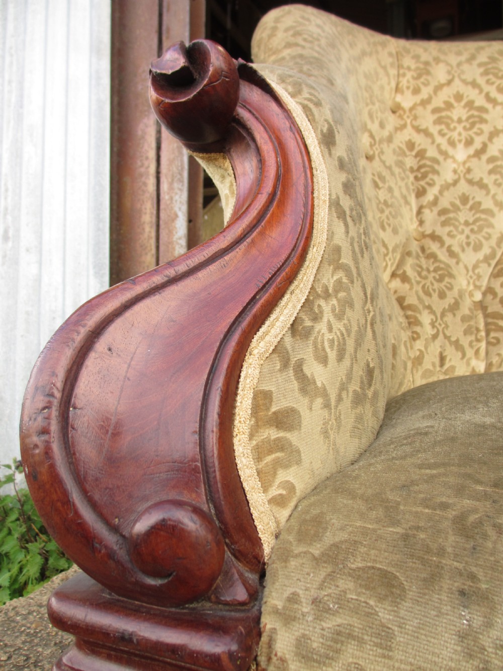 An early Victorian mahogany showood sofa with button-tufted gold damask upholstery and carved cabriole legs. View VII
