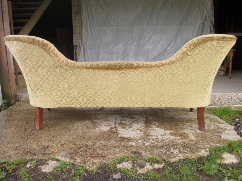 An early Victorian mahogany showood sofa with button-tufted gold damask upholstery and carved cabriole legs. View X