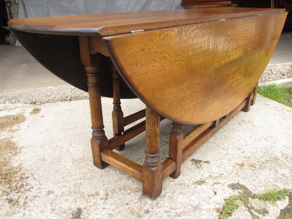 Early 20th century large golden oak wake oval drop leaf dining table View IV