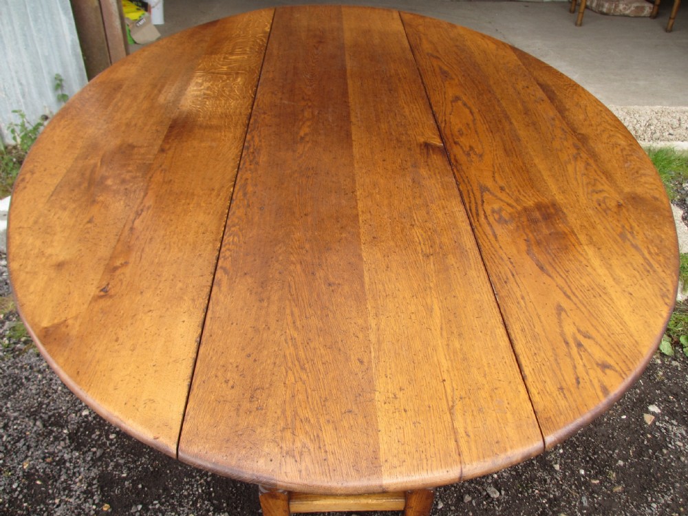 Early 20th century large golden oak wake oval drop leaf dining table View XI
