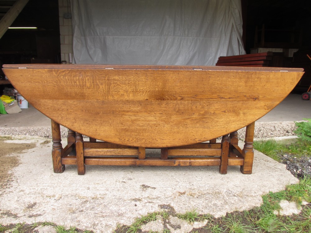 Early 20th century large golden oak wake oval drop leaf dining table View XIII