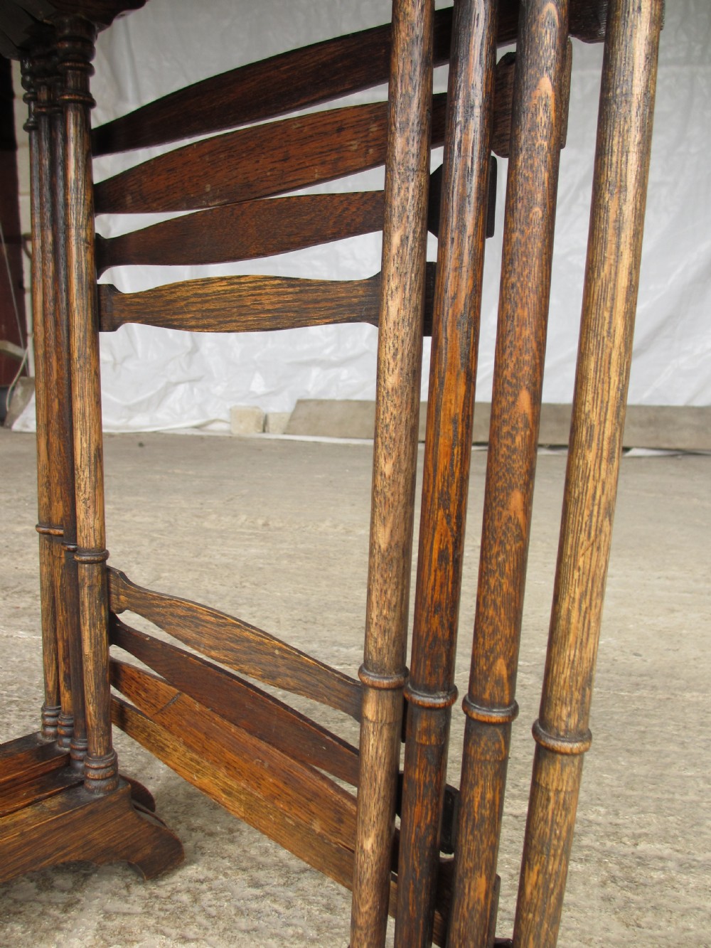 A set of four graduating nineteenth-century oak nesting tables with slender turned legs and rectangular tops. View V