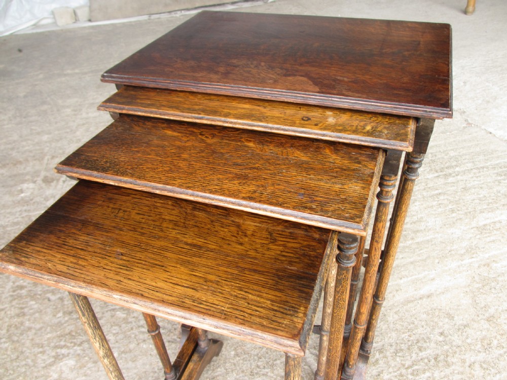 A set of four graduating nineteenth-century oak nesting tables with slender turned legs and rectangular tops. View VI