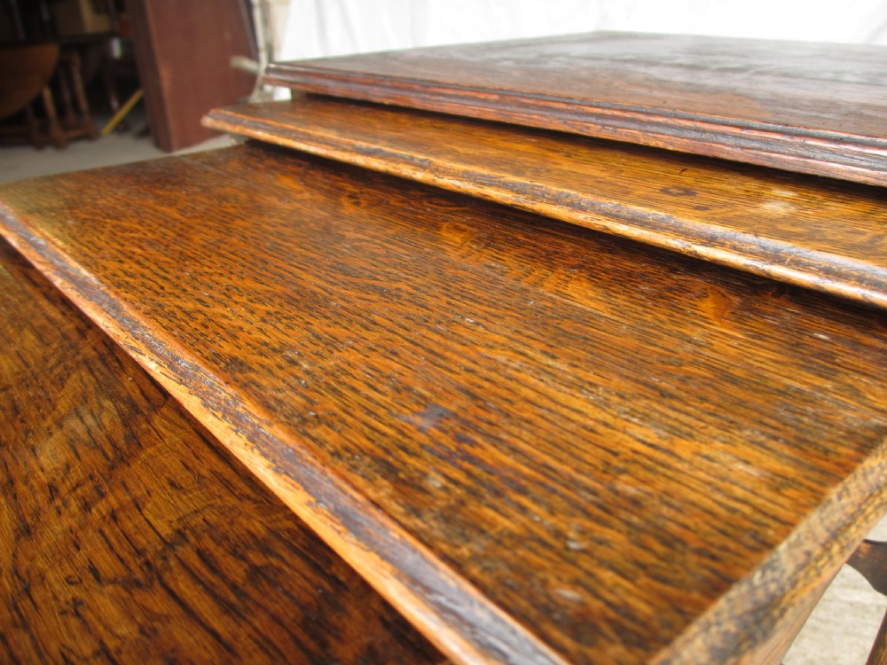 A set of four graduating nineteenth-century oak nesting tables with slender turned legs and rectangular tops. View VII