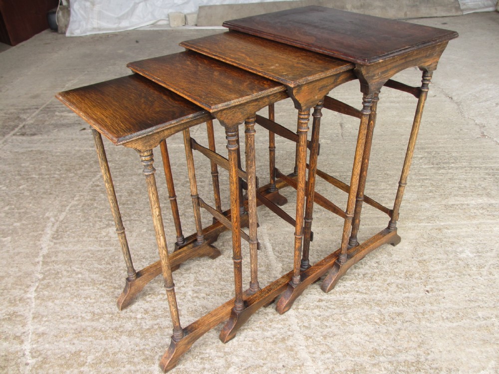 A set of four graduating nineteenth-century oak nesting tables with slender turned legs and rectangular tops. View VIII