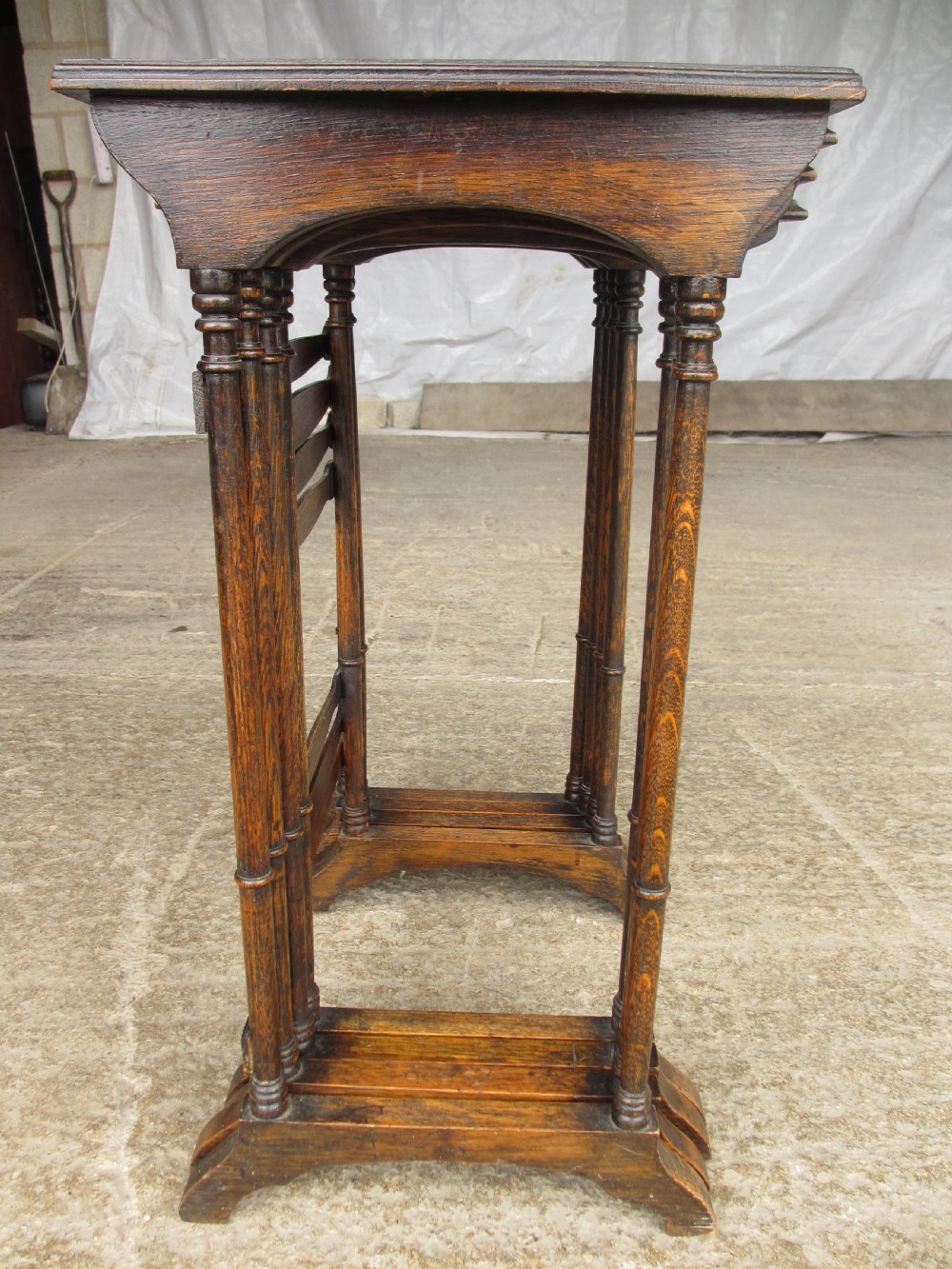 A set of four graduating nineteenth-century oak nesting tables with slender turned legs and rectangular tops. View XI