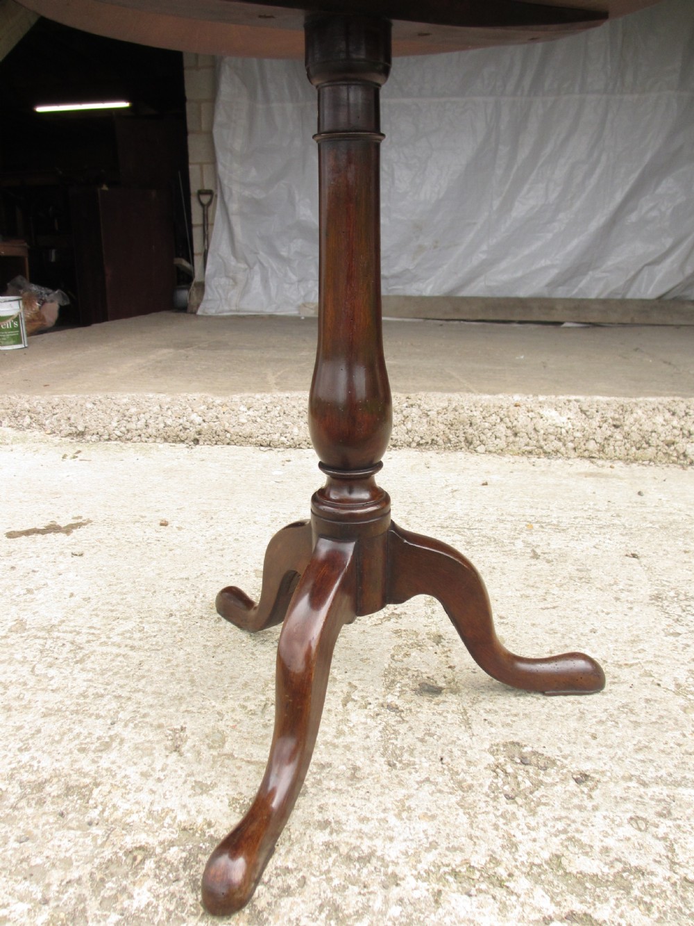 A circular Georgian mahogany tripod table featuring a central inlaid satinwood rosette, turned pedestal stem, and three curved legs. View VIII