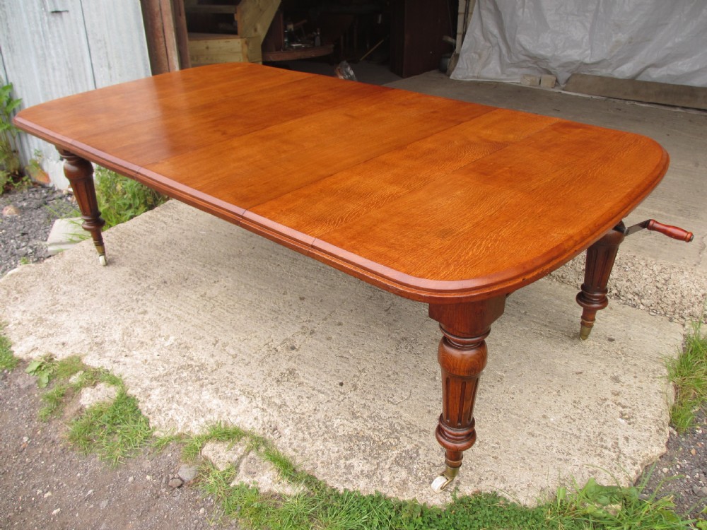 Victorian golden oak wind out extending dining table 