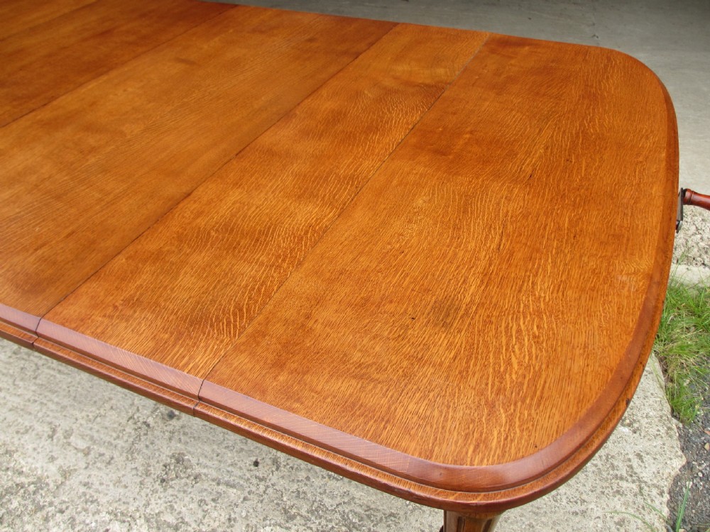 Victorian golden oak wind out extending dining table  View IX