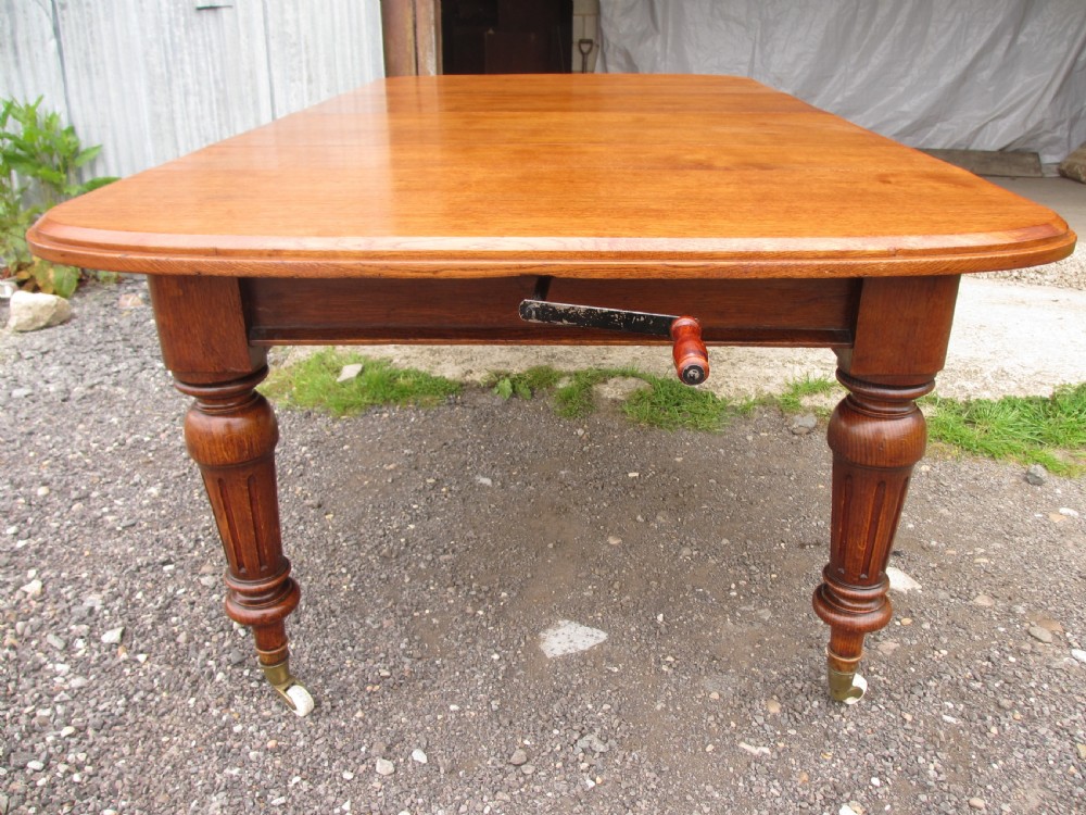 Victorian golden oak wind out extending dining table  View X
