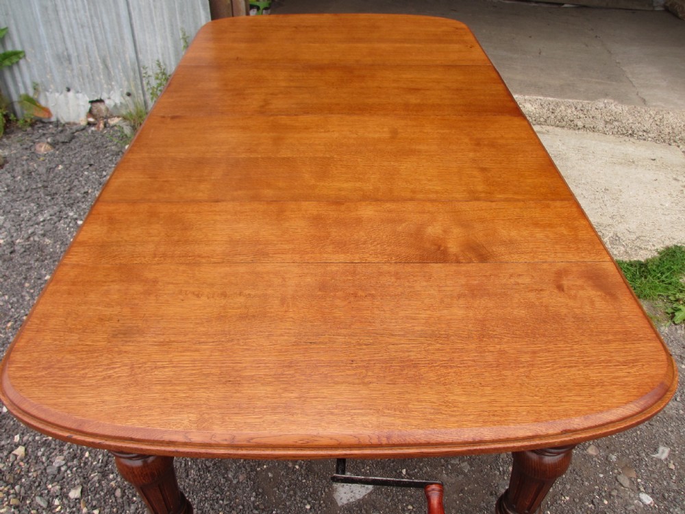 Victorian golden oak wind out extending dining table  View XI