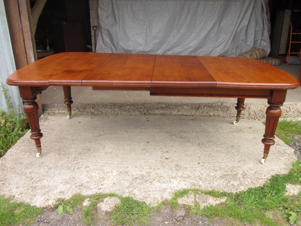 Victorian golden oak wind out extending dining table  View XII