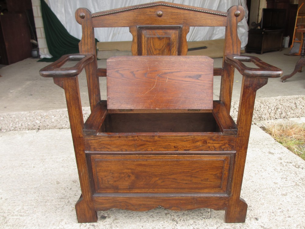 Victorian small oak hall settle with panelled back View IX
