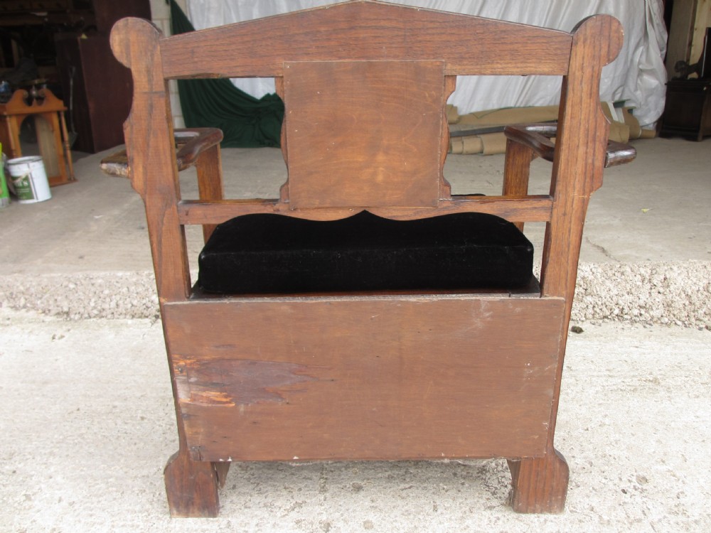 Victorian small oak hall settle with panelled back View XII