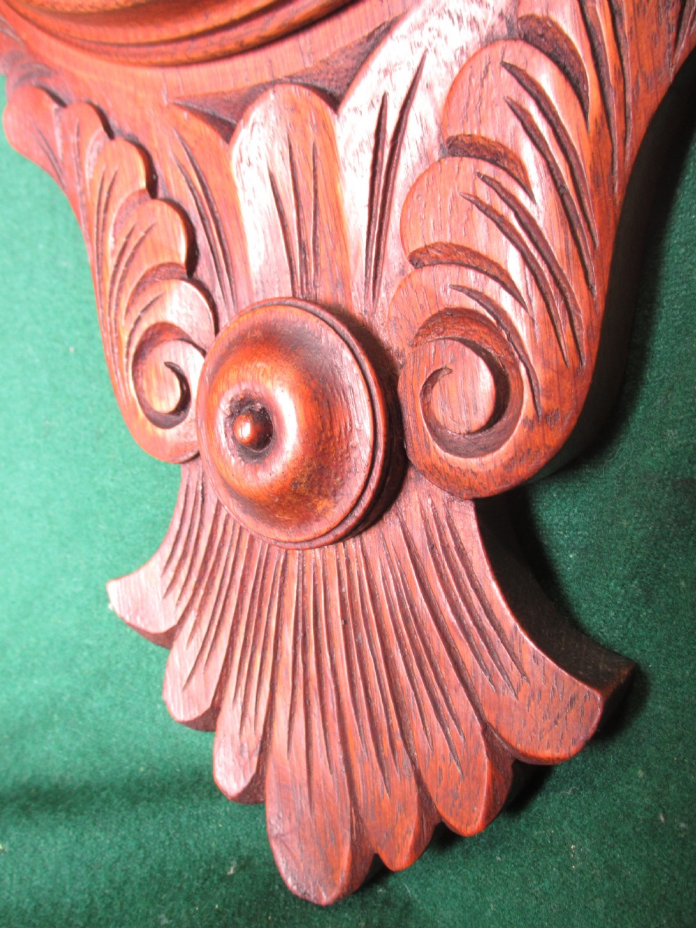 A Victorian carved oak wall barometer featuring an upper thermometer, intricate leaf scrollwork motifs, and a circular white dial with a brass bezel. View IX