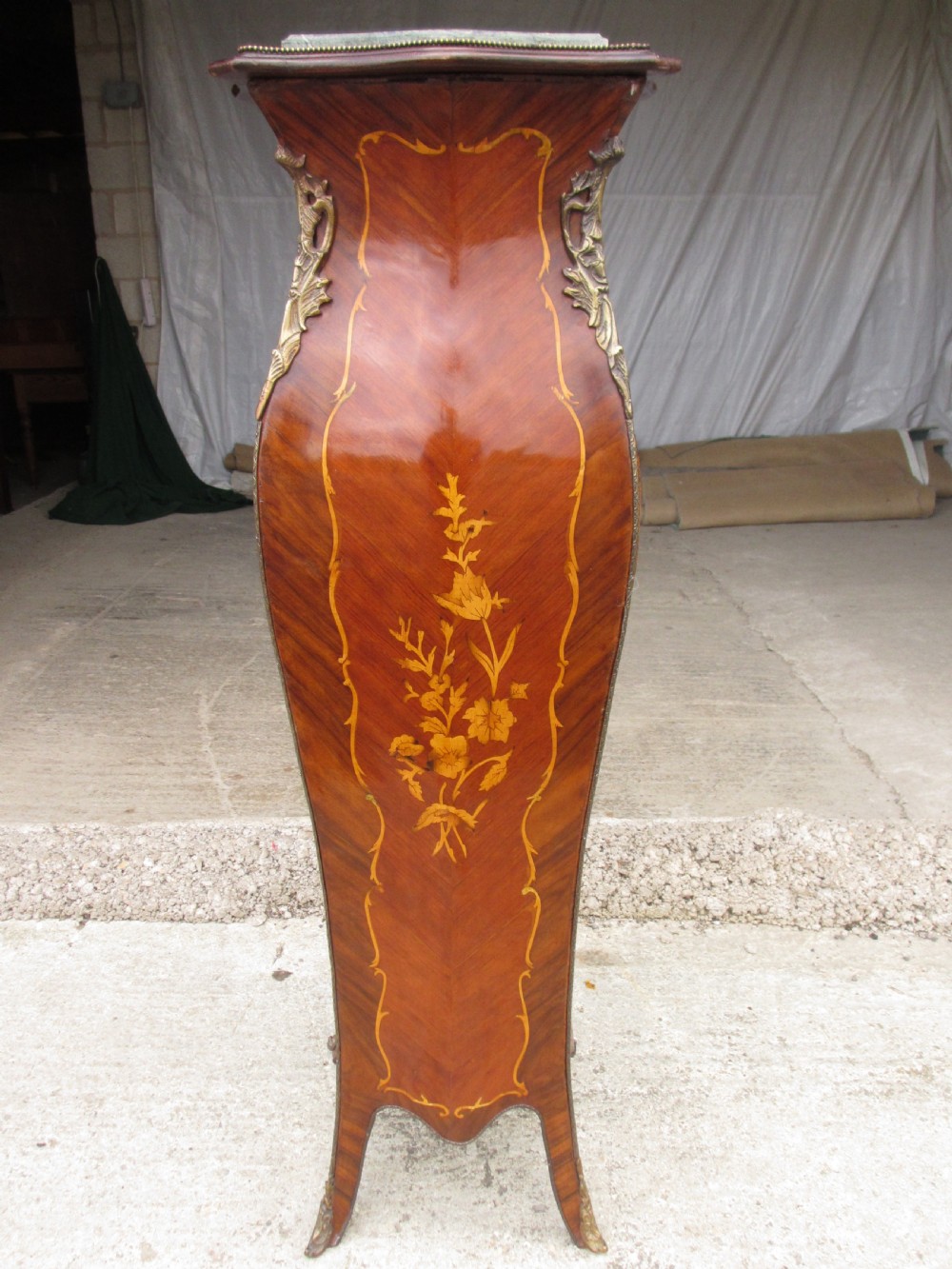 A pair of tall French Louis XV style wooden pedestals featuring floral marquetry inlays, curved silhouettes, and decorative gilt-bronze mounts. View VIII