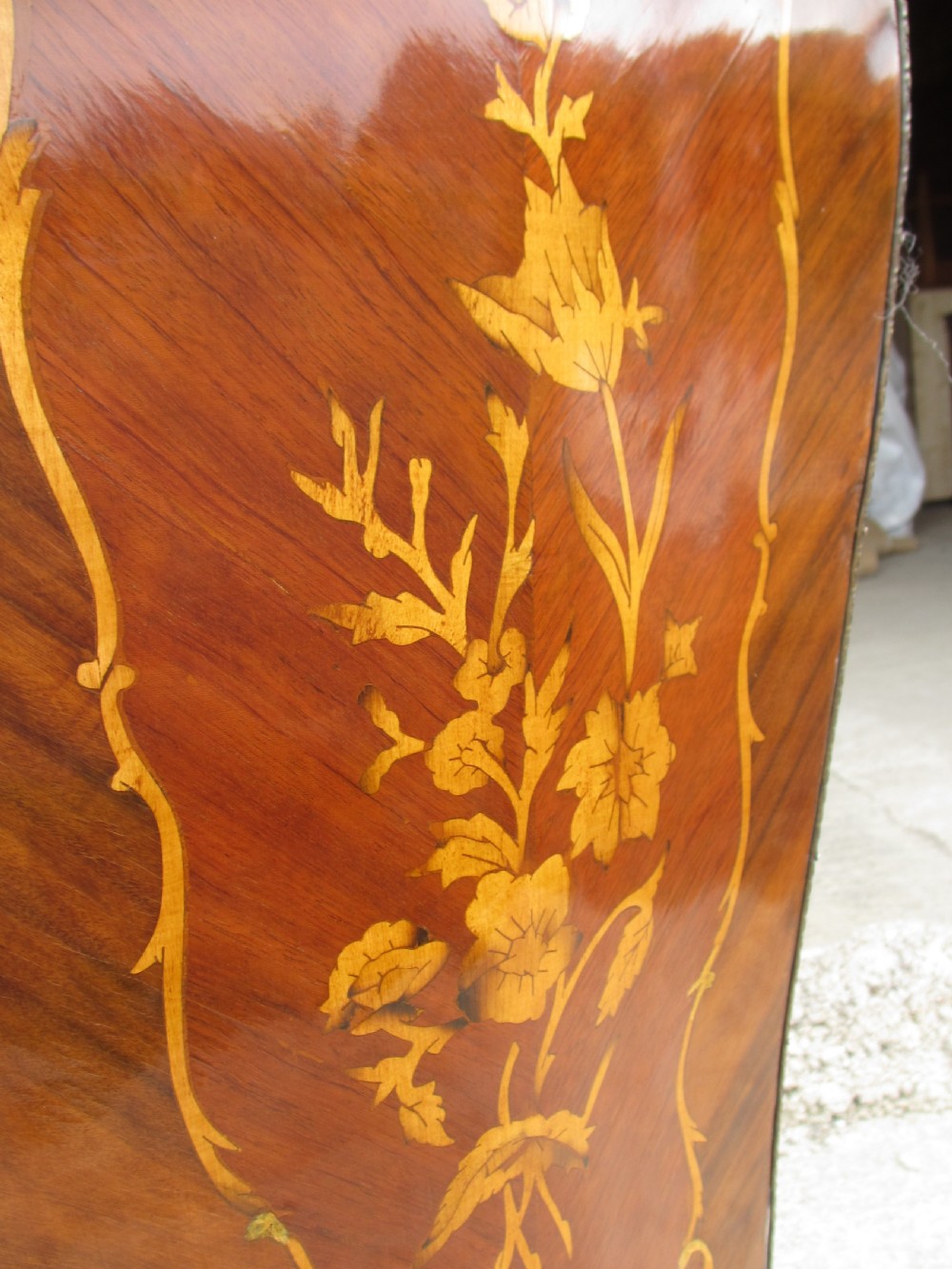 A pair of tall French Louis XV style wooden pedestals featuring floral marquetry inlays, curved silhouettes, and decorative gilt-bronze mounts. View XI
