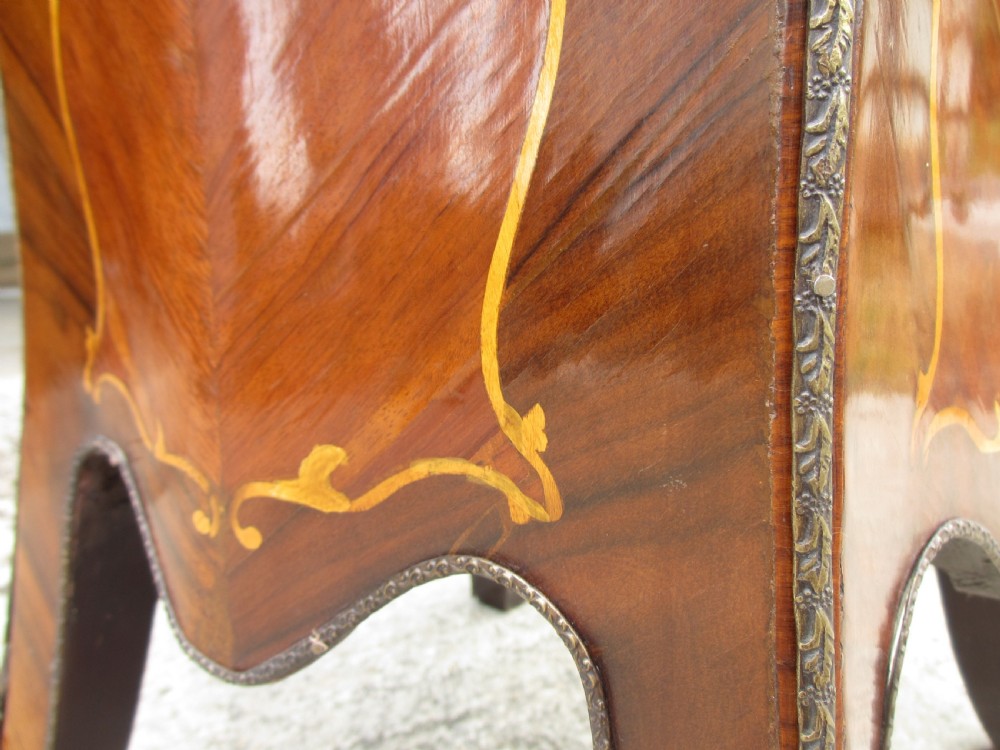 A pair of tall French Louis XV style wooden pedestals featuring floral marquetry inlays, curved silhouettes, and decorative gilt-bronze mounts. View XII