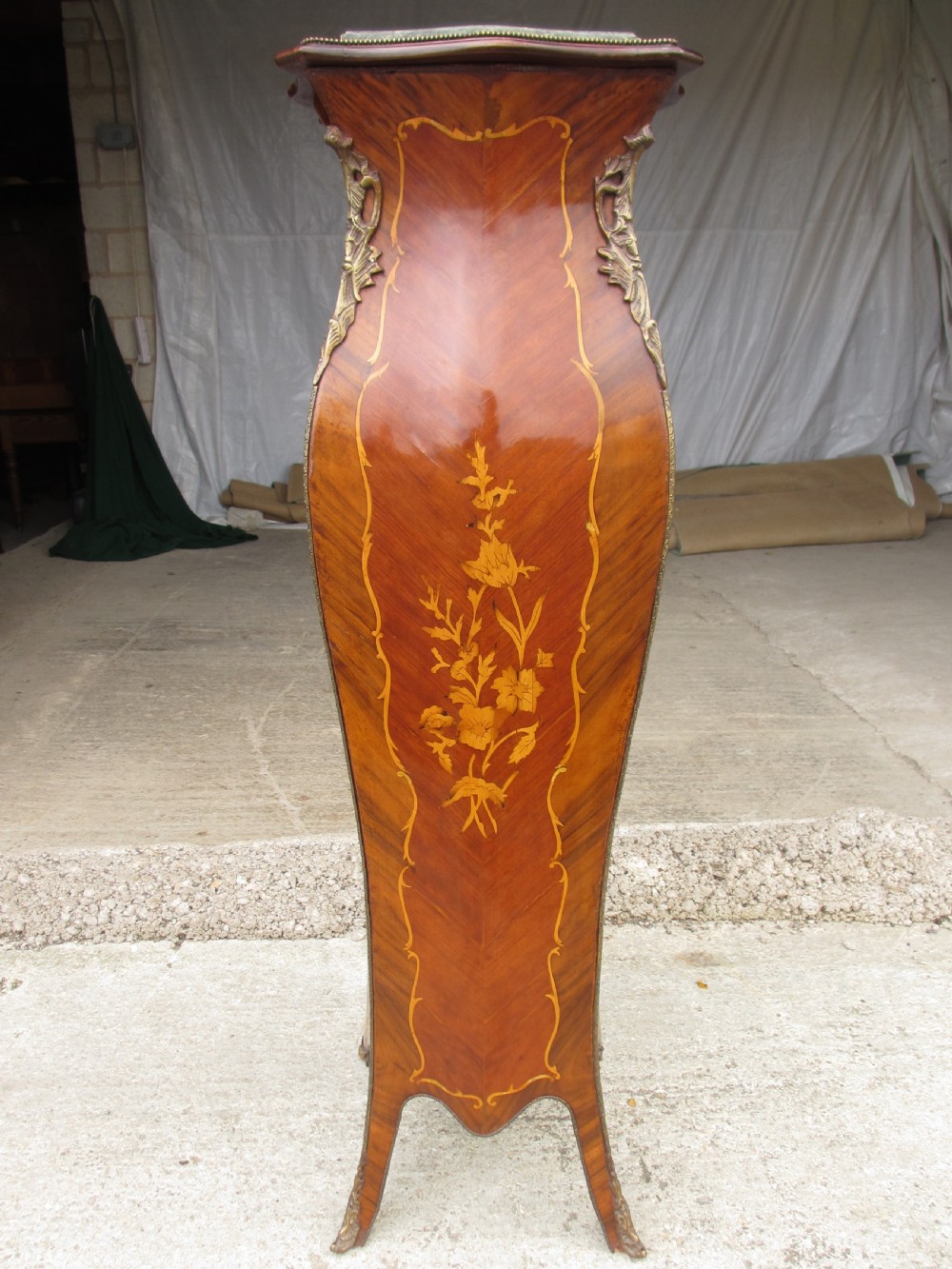 A pair of tall French Louis XV style wooden pedestals featuring floral marquetry inlays, curved silhouettes, and decorative gilt-bronze mounts. View XIII