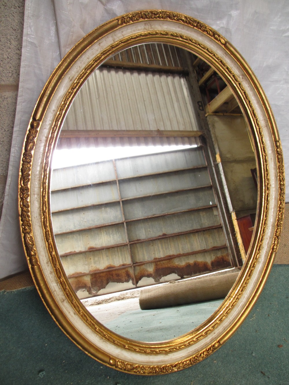 Victorian oval gilt and white framed wall hanging mirror