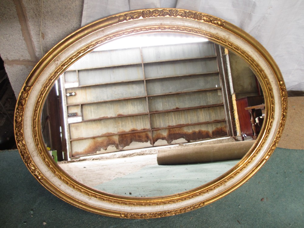 Victorian oval gilt and white framed wall hanging mirror View II