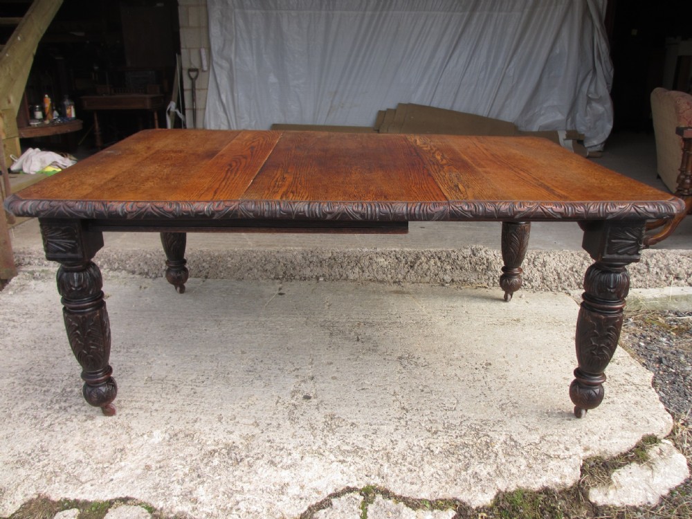 Victorian oak carved extending dining table View IV