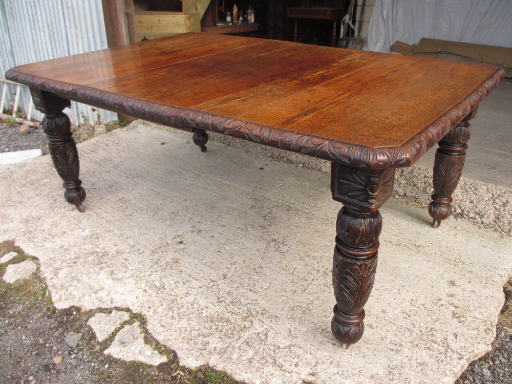 Victorian oak carved extending dining table View II
